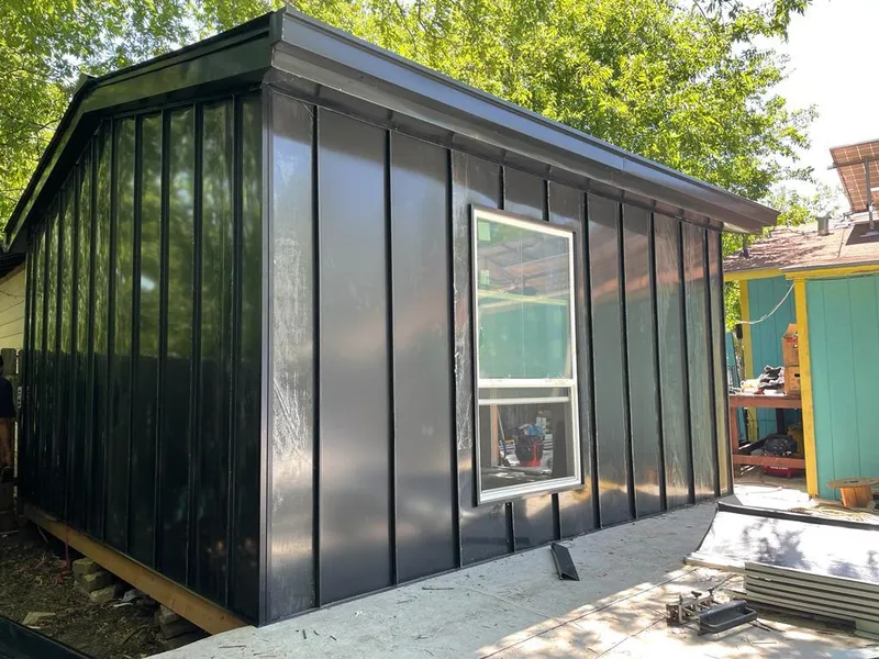 Black standing seam metal wall panels for Roof Inspection in Ogdensburg