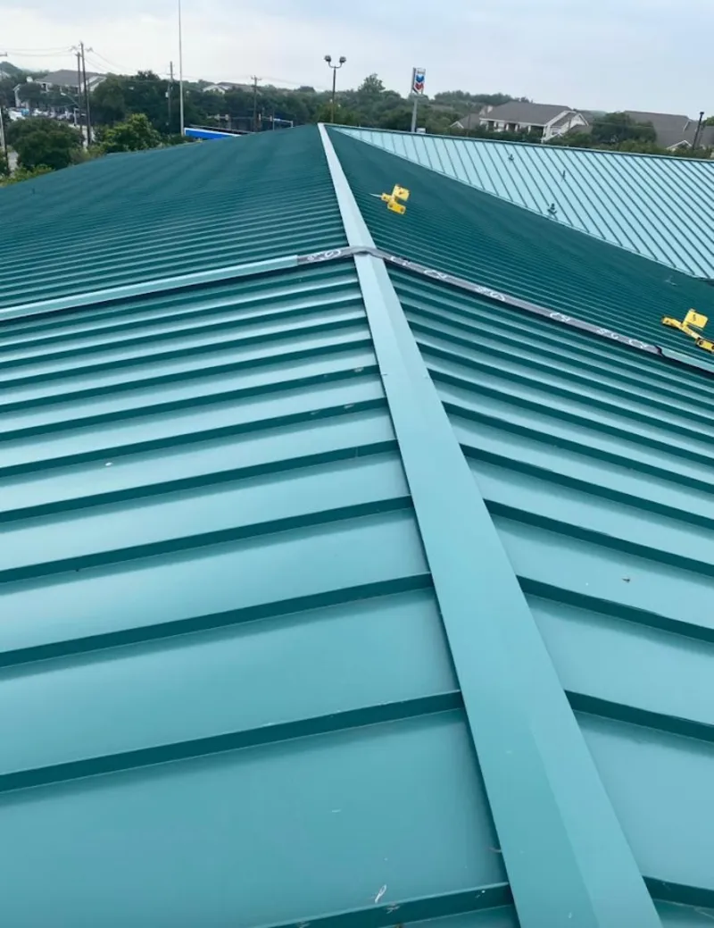 Green commercial metal roof ridge and valley for Metal Roof Repair in Ogdensburg